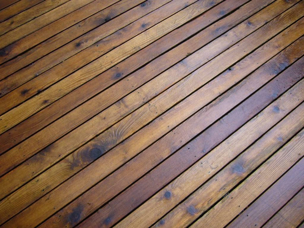 Transparent deck stain on wood, grain fully visible